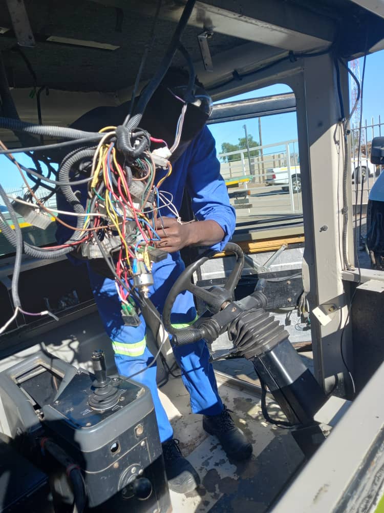 HVAC technician repairing an air conditioning unit