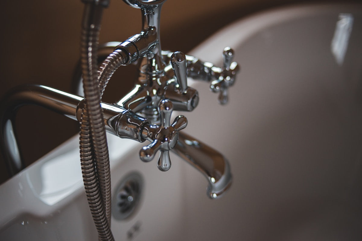 Plumber repairing a residential sink